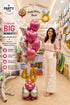 Personalized birthday balloon bouquet with custom name bubble balloon, heart balloons, star balloons, and age number balloons.