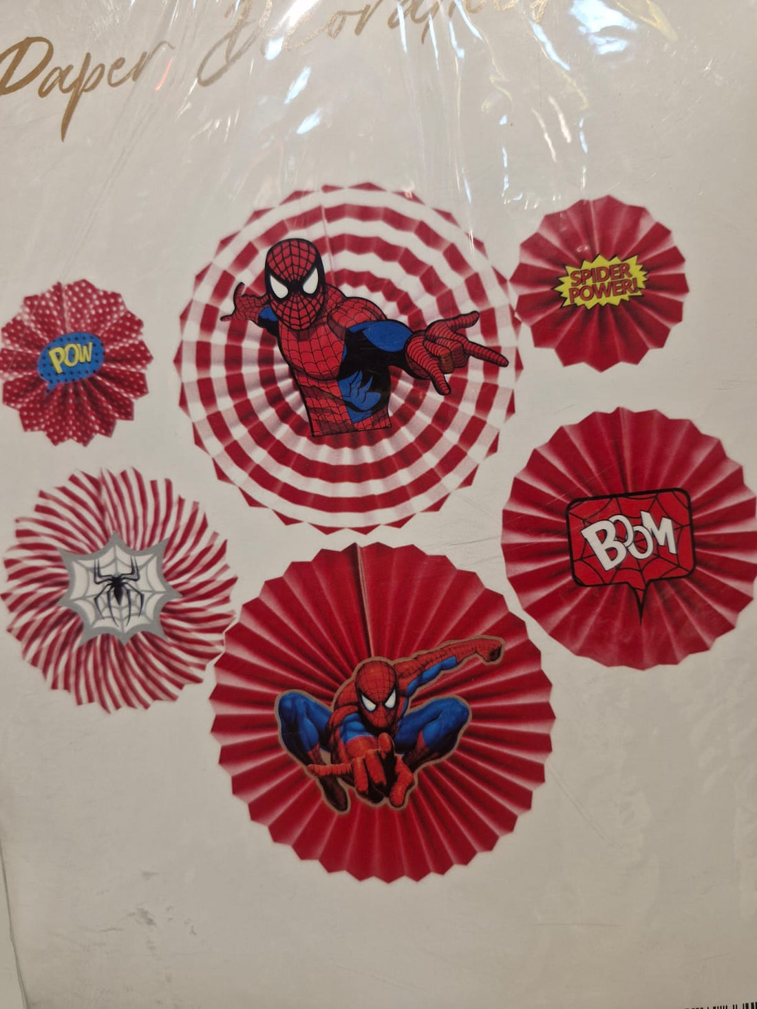 Red and white Spider-Man theme paper fan set with Spider-Man graphics and comic-style action words, displayed for kids’ superhero party decor.